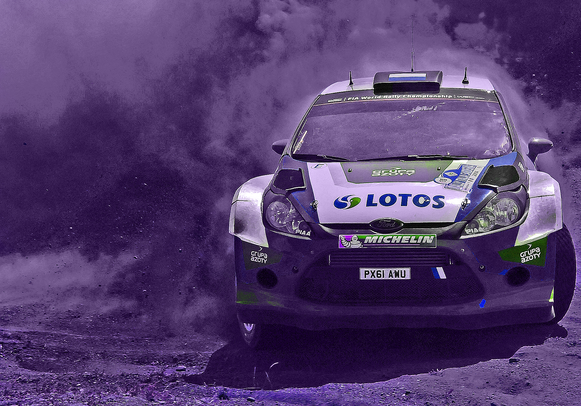 Rally car covered in sponsor logos